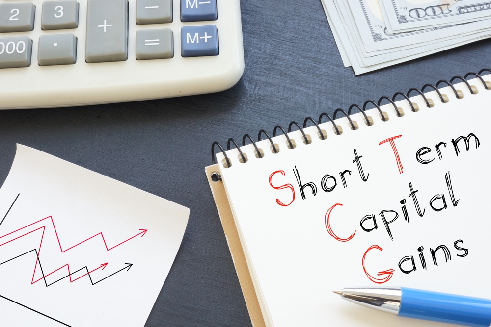Short Term Capital Gains Written on Notebook