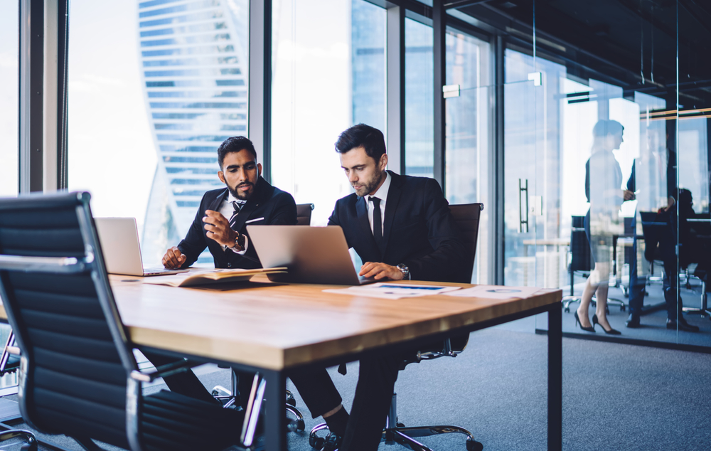 Two Men Discussing a Bank Exam