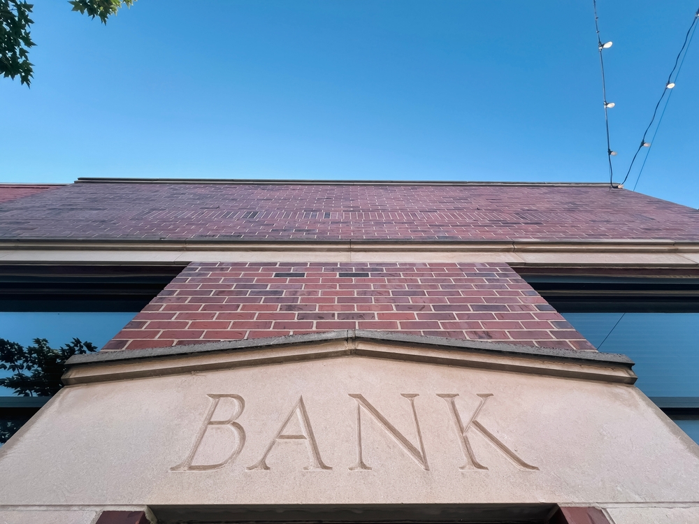 Brick Building Facade With Bank on Wall